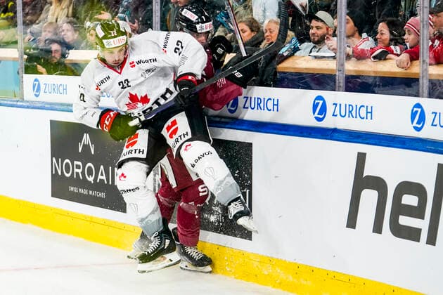 DAVOS, SWITZERLAND DECEMBER 26 Alan Quine of Team Canada hit on Ondrej Miklis of Sparta Prague during the match between HC Sparta Praha and Team Canada at Hockey Club Davos on December 26, 2022 in Davos, Switzerland Davos Graubunden Switzerland  Copyright: xJustPictures.ch JarixPestelaccix