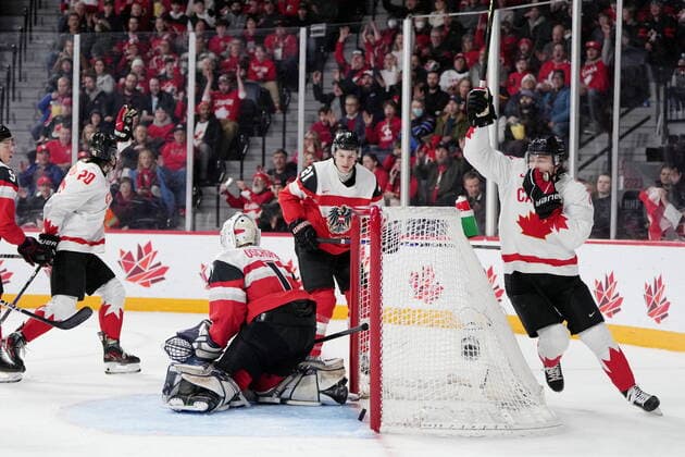 December 29, 2022, Halifax, NS, Canada: Canada™s Colton Dach, right, and Zack Ostapchuk, left, react to a goal in front of Austria s Tim Geifes, second from right, and goaltender Benedikt Oschgan during second period IIHF World Junior Hockey Championship action in Halifax on Thursday, December 29, 2022. Colton Dach, Zack Ostapchuk, Tim Geifes, Benedikt Oschgan  - ZUMAc35_ 20221229_zaf_c35_068 Copyright: xDarrenxCalabresex