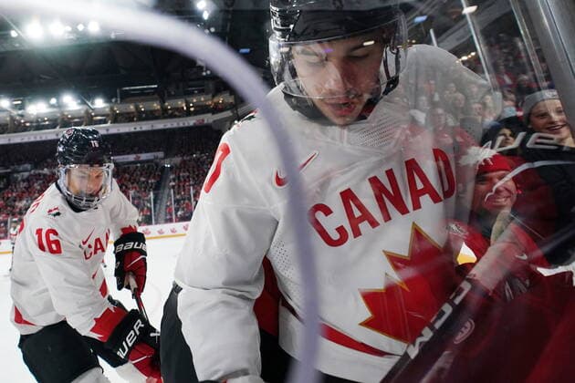 December 29, 2022, Halifax, NS, Canada: Fans are reflected in the glass as CanadaöÄÃ s Logan Stankoven, right, and Connor Bedard dig the puck out of the corner during second period IIHF World Junior Hockey Championship action against Austria in Halifax on Thursday, December 29, 2022. Logan Stankoven, Connor Bedard  - ZUMAc35_ 20221229_zaf_c35_083 Copyright: xDarrenxCalabresex