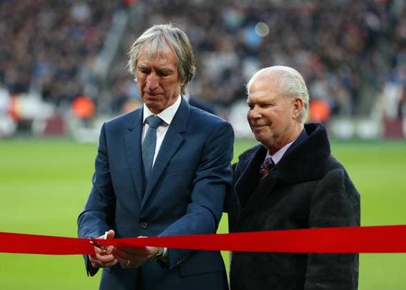2nd March 2019, London Stadium, London, England; EPL Premier League football, West Ham United versus Newcastle United; West Ham United legend Billy Bonds MBE cutting the ribbon alongside West Ham United co owner David Gold to open the Billy Bonds Stand before kick off  ActionPlus12110074 JohnxPatrickxFletcher