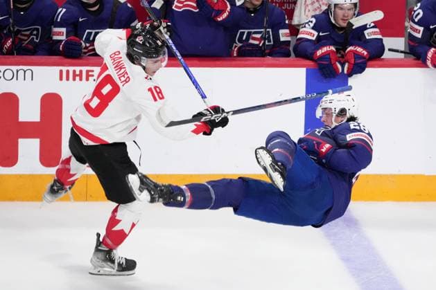 January 4, 2023, Halifax, NS, Canada: Canada s Caedan Bankier, left, checks USA s Charlie Stramel during first period IIHF World Junior Hockey Championship semifinal action in Halifax on Wednesday, January 4, 2023. Caedan Bankier, Charlie Stramel  - ZUMAc35_ 20230104_zaf_c35_088 Copyright: xDarrenxCalabresex