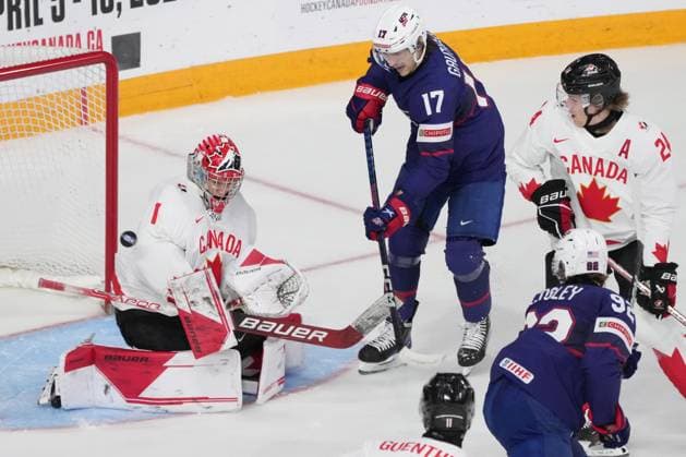 January 4, 2023, Halifax, NS, Canada: Canada goaltender Thomas Milic, left, makes a save as USA s Cutter Gauthier, centre, looks for a rebound during first period IIHF World Junior Hockey Championship semifinal action in Halifax on Wednesday, January 4, 2023. Cutter Gauthier, Thomas Milic  - ZUMAc35_ 20230104_zaf_c35_096 Copyright: xDarrenxCalabresex