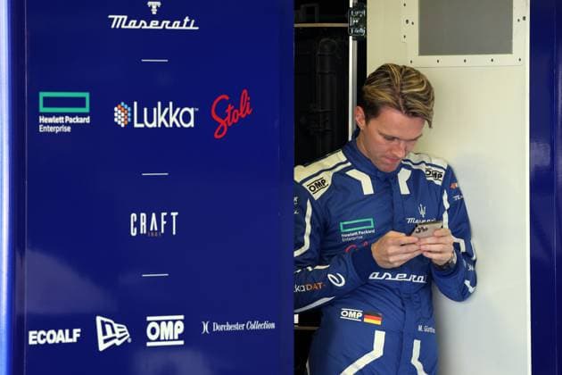 Maximilian Günter GER standing with his smartphone in the Maserati garage, Formula E FIA World Championship, Season 9, Mexico City E Prix, 12 01 2023, MEX, portrait, laughing