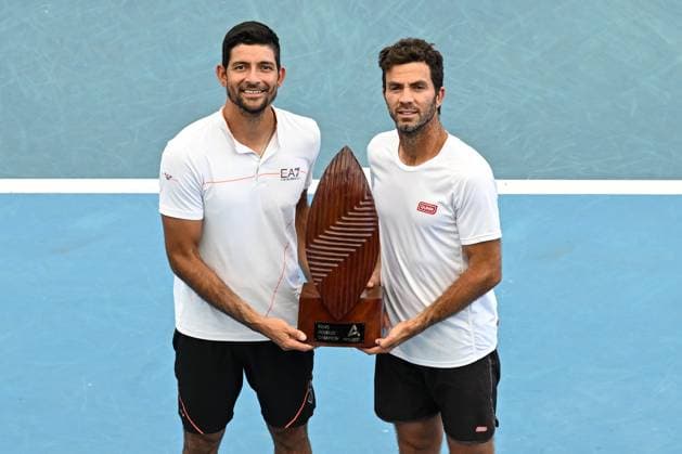 TENNIS ADELAIDE INTERNATIONAL, Marcelo Arevalo of Salvador (L) and Jean-Julien Rojer of the Netherlands (R) accepting the Men?s Doubles Champions Trophy during the 2023 Adelaide International Tennis Tournament at the Memorial Drive Tennis Centre in Adelaide, Saturday, January 14, 2023. ( NO ARCHIVING, EDITORIAL USE ONLY, NO USE IN BOOKS WITHOUT CONSENT ADELAIDE SOUTH AUSTRALIA AUSTRALIA  Copyright: xMICHAELxERREYx 20230114001752094674