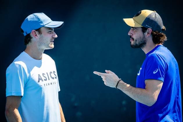 Belgian David Goffin and Goffin s coach Germain Gigounon pictured during a training session ahead of the Australian Open tennis Grand Slam, Saturday 14 January 2023 in Melbourne Park, Melbourne, Australia. PATRICKxHAMILTON  x58146761x