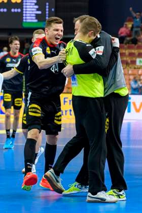 Katowice, 15 January 2023 Handball IHF World Championship, Preliminary Round, Group E, Germany Serbia from left Christoph Steinert Germany , Goalkeeper Joel Birlehm Germany , Goalkeeper Andreas Wolff Germany Final Cheer Final Cheer Emotion Joy Katowice Spodek Arena Poland