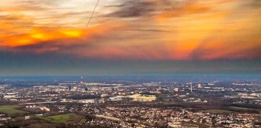 Aerial view, glowing red evening sky over Dortmund and Signal Iduna Park soccer stadium, Westfalenhalle, Dortmund, Ruhr area, North Rhine Westphalia, Germany ATTENTIONxMINESTHONORARx60xEURO