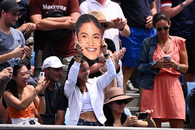 Mandatory Credit: Photo by James Gourley Shutterstock (13714310an) A fan holding a cutout of Emma Raducanu s face watches as Emma Raducanu celebrates victory in her first round match Australian Open, Day One, Tennis, Melbourne Park, Melbourne, Australia - 16 Jan 2023 Australian Open, Day One, Tennis, Melbourne Park, Melbourne, Australia - 16 Jan 2023 Copyright: xJamesxGourley Shutterstockx 13714310an