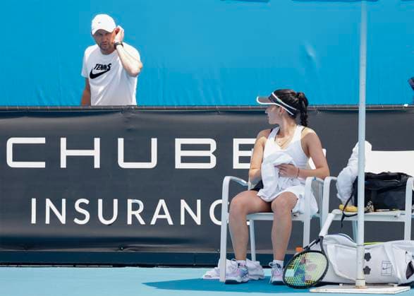 Eva Lys sits on the chair and talks to her father Vladimir who is standing behind the rail, Australian Open 2023, Melbourne Park, Melbourne, Victoria, Australia Copyright: xJuergenxHasenkopfx