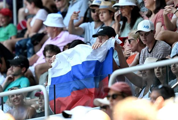 TENNIS AUSTRALIAN OPEN, A Russian flag is displayed by spectators during the first round singles match between Andrey Rublev of Russia and Dominic Them of Austria at the 2023 Australian Open tennis tournament at Melbourne Park in Melbourne, Tuesday, January 17, 2023. ( NO ARCHIVING, EDITORIAL USE ONLY, NO USE IN BOOKS WITHOUT CONSENT MELBOURNE VICTORIA AUSTRALIA  Copyright: xLUKASxCOCHx 20230117001753357869