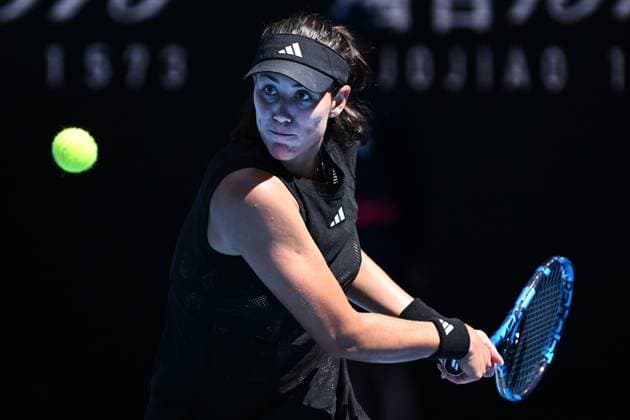 TENNIS AUSTRALIAN OPEN, Garbine Muguruza of Spain returns during her 1st round singles match against Elise Mertens of Belgium during 2023 Australian Open tennis tournament at Melbourne Park in Melbourne, Tuesday, January 17, 2023. ( NO ARCHIVING, EDITORIAL USE ONLY, NO USE IN BOOKS WITHOUT CONSENT MELBOURNE VICTORIA AUSTRALIA  Copyright: xJOELxCARRETTx 20230117001753407054