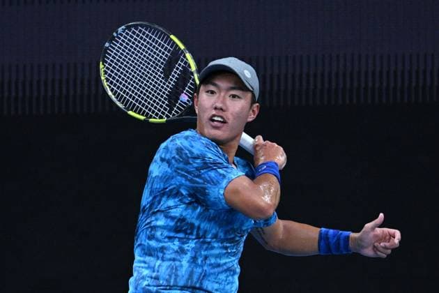 TENNIS AUSTRALIAN OPEN, Yu Hsiou Hsu of Hong Kong returns during his 1st round singles match against Alex de Minaur of Australia during 2023 Australian Open tennis tournament at Melbourne Park in Melbourne, Tuesday, January 17, 2023. ( NO ARCHIVING, EDITORIAL USE ONLY, NO USE IN BOOKS WITHOUT CONSENT MELBOURNE VICTORIA AUSTRALIA  Copyright: xJAMESxROSSx 20230117001753471512