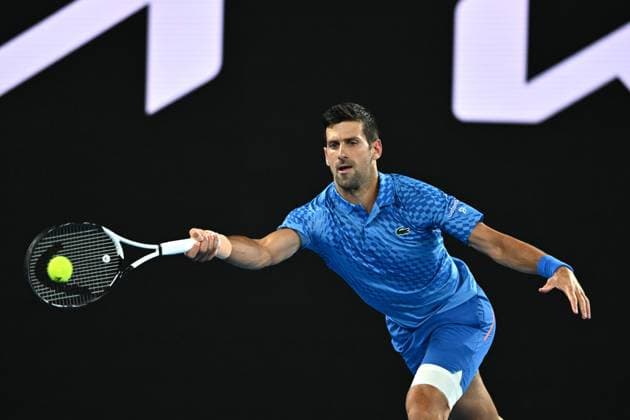 TENNIS AUSTRALIAN OPEN, Novak Djokovic of Serbia returns during his 1st round singles match against Roberto Carballes Baena of Spain during 2023 Australian Open tennis tournament at Melbourne Park in Melbourne, Tuesday, January 17, 2023. ( NO ARCHIVING, EDITORIAL USE ONLY, NO USE IN BOOKS WITHOUT CONSENT MELBOURNE VICTORIA AUSTRALIA  Copyright: xJOELxCARRETTx 20230117001753500341