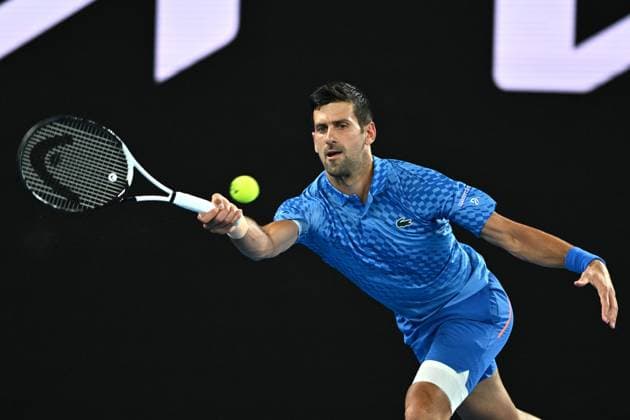TENNIS AUSTRALIAN OPEN, Novak Djokovic of Serbia returns during his 1st round singles match against Roberto Carballes Baena of Spain during 2023 Australian Open tennis tournament at Melbourne Park in Melbourne, Tuesday, January 17, 2023. ( NO ARCHIVING, EDITORIAL USE ONLY, NO USE IN BOOKS WITHOUT CONSENT MELBOURNE VICTORIA AUSTRALIA  Copyright: xJOELxCARRETTx 20230117001753500573