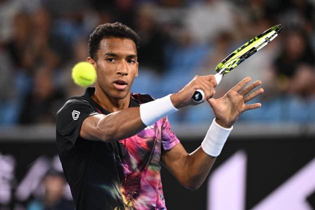 TENNIS AUSTRALIAN OPEN, Felix Auger-Aliassime of Canada in action against Alex Molcan of Slovakia during the 2023 Australian Open tennis tournament at Melbourne Park in Melbourne, Wednesday, January 18, 2023. ( NO ARCHIVING, EDITORIAL USE ONLY, NO USE IN BOOKS WITHOUT CONSENT MELBOURNE VICTORIA AUSTRALIA  Copyright: xJOELxCARRETTx 20230118001753723284