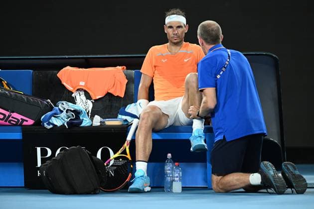 TENNIS AUSTRALIAN OPEN, Rafael Nadal of Spain receives medical treatment during his match against Mackenzie McDonald of the USA during the 2023 Australian Open tennis tournament at Melbourne Park in Melbourne, Wednesday, January 18, 2023. ( NO ARCHIVING, EDITORIAL USE ONLY, NO USE IN BOOKS WITHOUT CONSENT MELBOURNE VICTORIA AUSTRALIA  Copyright: xDIEGOxFEDELEx 20230118001753761815