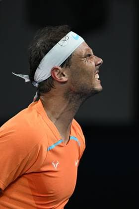 TENNIS AUSTRALIAN OPEN, Rafael Nadal of Spain grimaces in pain during his match against Mackenzie McDonald of the USA during the 2023 Australian Open tennis tournament at Melbourne Park in Melbourne, Wednesday, January 18, 2023. ( NO ARCHIVING, EDITORIAL USE ONLY, NO USE IN BOOKS WITHOUT CONSENT MELBOURNE VICTORIA AUSTRALIA  Copyright: xDIEGOxFEDELEx 20230118001753761856