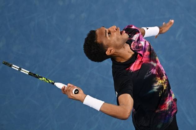 TENNIS AUSTRALIAN OPEN, Felix Auger-Aliassime of Canada in action during his match against Alex Molcan of Slovakia during the 2023 Australian Open tennis tournament at Melbourne Park in Melbourne, Wednesday, January 18, 2023. ( NO ARCHIVING, EDITORIAL USE ONLY, NO USE IN BOOKS WITHOUT CONSENT MELBOURNE VICTORIA AUSTRALIA  Copyright: xJOELxCARRETTx 20230118001753773634