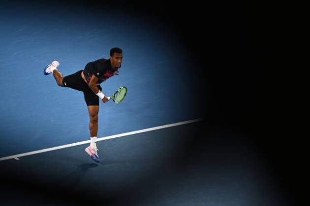 TENNIS AUSTRALIAN OPEN, Felix Auger-Aliassime of Canada in action during his match against Alex Molcan of Slovakia during the 2023 Australian Open tennis tournament at Melbourne Park in Melbourne, Wednesday, January 18, 2023. ( NO ARCHIVING, EDITORIAL USE ONLY, NO USE IN BOOKS WITHOUT CONSENT MELBOURNE VICTORIA AUSTRALIA  Copyright: xJOELxCARRETTx 20230118001753773766