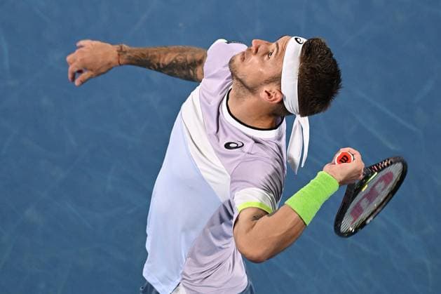 TENNIS AUSTRALIAN OPEN, Alex Molcan of Slovakia serves during his match against Felix Auger-Aliassime of Canada during the 2023 Australian Open tennis tournament at Melbourne Park in Melbourne, Wednesday, January 18, 2023. ( NO ARCHIVING, EDITORIAL USE ONLY, NO USE IN BOOKS WITHOUT CONSENT MELBOURNE VICTORIA AUSTRALIA  Copyright: xLUKASxCOCHx 20230118001753776687