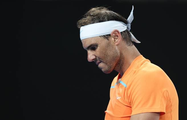 (230118) -- MELBOURNE, Jan. 18, 2023 -- Rafael Nadal reacts during the men s singles 2nd round match against Mackenzie McDonald of the United States at Australian Open tennis tournament in Melbourne, Australia, on Jan. 18, 2023. ) (SP)AUSTRALIA-MELBOURNE-TENNIS-AUSTRALIAN OPEN-DAY 3 BaixXuefei 