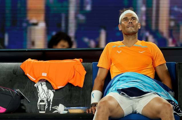 Mandatory Credit: Photo by Ella Ling Shutterstock (13716761bh) Rafael Nadal of Spain dejected following a hip injury Australian Open, Day Three, Tennis, Melbourne Park, Melbourne, Australia - 18 Jan 2023 Australian Open, Day Three, Tennis, Melbourne Park, Melbourne, Australia - 18 Jan 2023 Copyright: xEllaxLing Shutterstockx 13716761bh