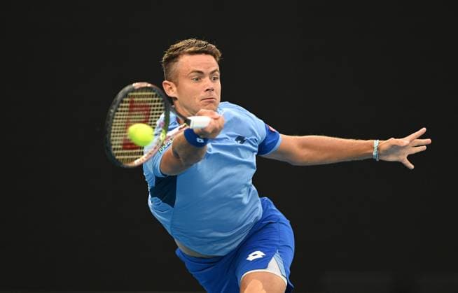 TENNIS AUSTRALIAN OPEN, Enzo Couacaud of France returns during his second round match against Novak Djokorvic of Serbia during the 2023 Australian Open tennis tournament at Melbourne Park in Melbourne, Thursday, January 19, 2023. ( NO ARCHIVING, EDITORIAL USE ONLY, NO USE IN BOOKS WITHOUT CONSENT MELBOURNE VICTORIA AUSTRALIA  Copyright: xLUKASxCOCHx 20230119001754240563