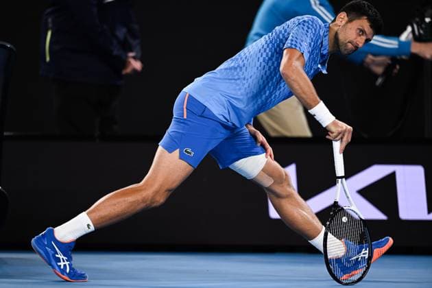 Mandatory Credit: Photo by James Gouley Shutterstock (13716770fa) Novak Djokovic stretches during his second round match Australian Open, Day Four, Tennis, Melbourne Park, Melbourne, Australia - 19 Jan 2023 Australian Open, Day Four, Tennis, Melbourne Park, Melbourne, Australia - 19 Jan 2023 Copyright: xJamesxGouley Shutterstockx 13716770fa