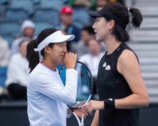 (230119) -- MELBOURNE, Jan. 19, 2023 -- Wang Xinyu (R) of China and Uchijima Moyuka of Japan react during the women s doubles first round match against Olivia Tjandramulia and Talia Gibson of Australia at Australian Open tennis tournament in Melbourne, Australia, on Jan. 19, 2023. (Photo By Hu Jingchen Xinhua) (SP)AUSTRALIA-MELBOURNE-TENNIS-AUSTRALIAN OPEN-DAY 4 BaixXuefei 