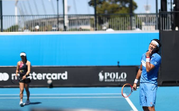 (230120) -- MELBOURNE, Jan. 20, 2023 -- Han Xinyun Zhang Zhizhen (R) of China compete during the mixed doubles first round match against Luisa Stefani Rafael Matos of Brazil at Australian Open tennis tournament in Melbourne, Australia, on Jan. 20, 2023. ) (SP)AUSTRALIA-MELBOURNE-TENNIS-AUSTRALIAN OPEN-DAY 5 BaixXuefei 