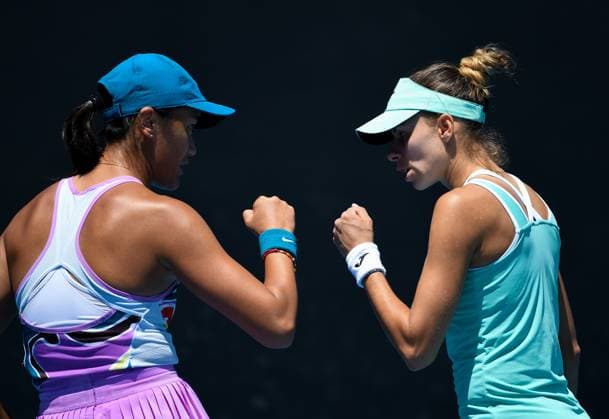 (230120) -- MELBOURNE, Jan. 20, 2023 -- Wang Xiyu of China and Megda Linette (R) of Poland react during the women s doubles first round match against Shuko Aoyama Ena Shibahara of Japan at Australian Open tennis tournament in Melbourne, Australia, on Jan. 20, 2023. ) (SP)AUSTRALIA-MELBOURNE-TENNIS-AUSTRALIAN OPEN-DAY 5 GuoxLei 