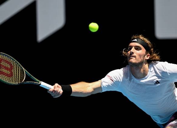 (230120) -- MELBOURNE, Jan. 20, 2023 -- Stefanos Tsitsipas of Greece hits a return during the men s singles third round match against Tallon Griekspoor of the Netherlands at Australian Open tennis tournament in Melbourne, Australia, on Jan. 20, 2023. ) (SP)AUSTRALIA-MELBOURNE-TENNIS-AUSTRALIAN OPEN-DAY 5 GuoxLei 