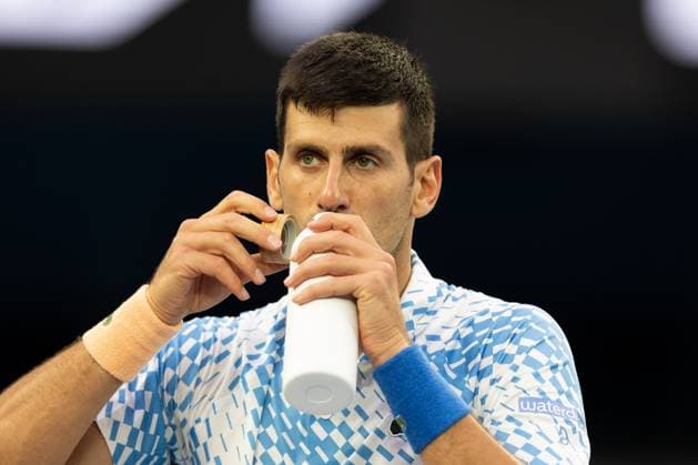 Novak Djokovic of Serbia takes a drink during the round 3 match between Novak Djokovic of Serbia and Grigor Dimitrov of Bulgaria, Day 6 at the Australian Open Tennis 2023 at Rod Laver Arena, Melbourne, Australia on 21 January 2023. Copyright: xPeterxDovganx 34781468