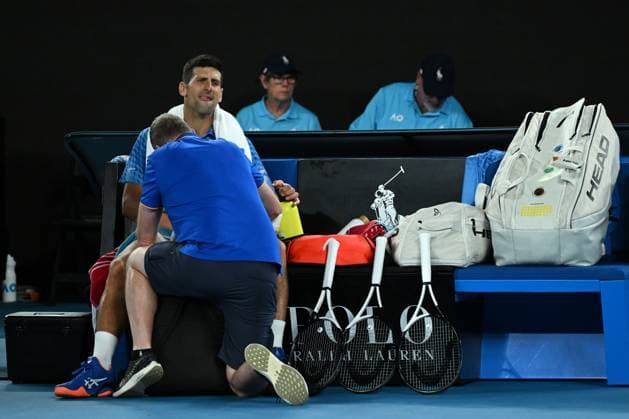 TENNIS AUSTRALIAN OPEN, Novak Djokovic of Serbia is seen during a medical time-out in his match against Grigor Dimitrov of Bulgaria during the 2023 Australian Open tennis tournament at Melbourne Park in Melbourne, Saturday, January 21, 2023. ( NO ARCHIVING, EDITORIAL USE ONLY, NO USE IN BOOKS WITHOUT CONSENT MELBOURNE VICTORIA AUSTRALIA  Copyright: xLUKASxCOCHx 20230121001755047491