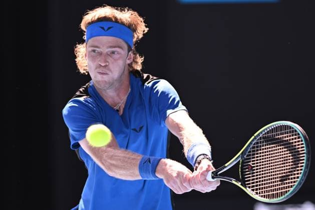 TENNIS AUSTRALIAN OPEN, Andrey Rublev of Russia returns to Holger Rune of Denmark during their fourth round match at 2023 Australian Open tennis championship at Melbourne Park in Melbourne, Monday, January 23. ( NO ARCHIVING, EDITORIAL USE ONLY, NO USE IN BOOKS WITHOUT CONSENT MELBOURNE VICTORIA AUSTRALIA  Copyright: xJAMESxROSSx 20230123001755793725