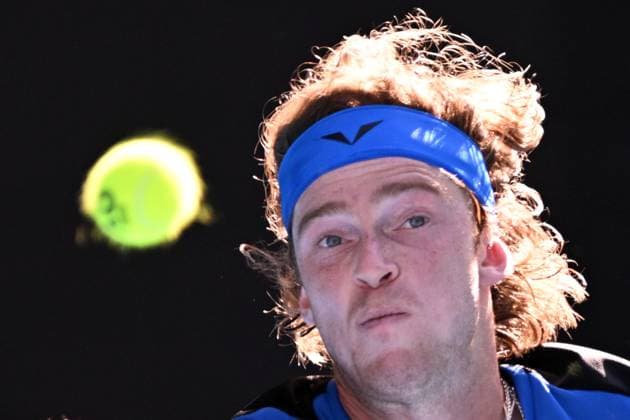 TENNIS AUSTRALIAN OPEN, Andrey Rublev of Russia returns to Holger Rune of Denmark during their fourth round match at 2023 Australian Open tennis championship at Melbourne Park in Melbourne, Monday, January 23. ( NO ARCHIVING, EDITORIAL USE ONLY, NO USE IN BOOKS WITHOUT CONSENT MELBOURNE VICTORIA AUSTRALIA  Copyright: xJAMESxROSSx 20230123001755798623