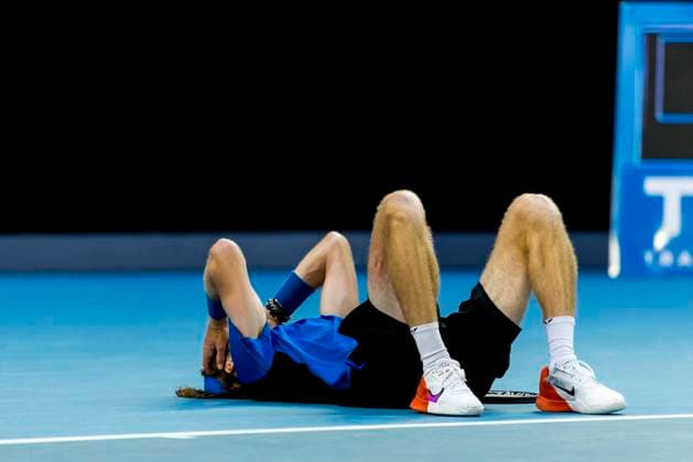 MELBOURNE, VIC - JANUARY 23: Andrey Rublev of Russia falls to the ground after realising he won his match during Round 4 of the 2023 Australian Open on January 23 2023, at Melbourne Park in Melbourne, Australia. (Photo by Jason Heidrich Icon Sportswire) TENNIS: JAN 23 Australian Open Icon230123137