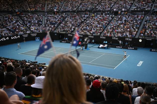 TENNIS AUSTRALIAN OPEN, A fan with Australian flags in her hair watches Alex de Minaur of Australia in during his match against Novak Djokovic of Serbia during the 2023 Australian Open tennis tournament at Melbourne Park in Melbourne, Monday, January 23, 2023. ( NO ARCHIVING, EDITORIAL USE ONLY, NO USE IN BOOKS WITHOUT CONSENT MELBOURNE VICTORIA AUSTRALIA  Copyright: xJOELxCARRETTx 20230123001755819415