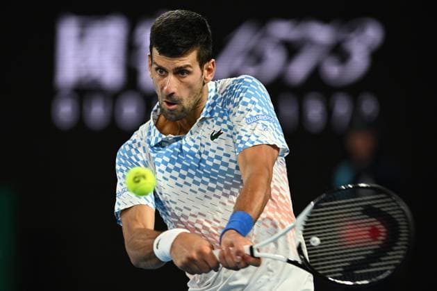 TENNIS AUSTRALIAN OPEN, Novak Djokovic of Serbia wins a point during his match against Alex de Minaur of Australia during the 2023 Australian Open tennis tournament at Melbourne Park in Melbourne, Monday, January 23, 2023. ( NO ARCHIVING, EDITORIAL USE ONLY, NO USE IN BOOKS WITHOUT CONSENT MELBOURNE VICTORIA AUSTRALIA  Copyright: xJOELxCARRETTx 20230123001755824580