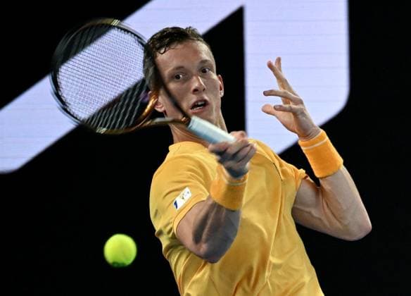 (230124) -- MELBOURNE, Jan. 24, 2023 -- Jiri Lehecka of the Czech Republic hits a return during the men s singles quarterfinal against Stefanos Tsitsipas of Greece at Australian Open at Melbourne Park in Melbourne, Australia, Jan. 24, 2023. ) (SP)AUSTRALIA-MELBOURNE-TENNIS-AUSTRALIAN OPEN-QUARTERFINALS GuoxLei 
