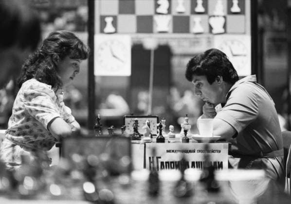 July 16-17, 1983. Moscow, USSR. Soviet chess masters Elmira Khorovets and Nona Gaprindashvili (L-R) compete during a duel at the preliminary chess round at the 1983 Summer Spartakiad of the USSR Peoples. The exact date of the photograph is unknown. Igor Utkin, Alexander Yakovlev TASS  17212154