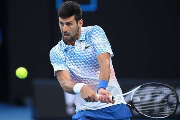 TENNIS AUSTRALIAN OPEN, Novak Djokovic of Serbia in action during his Quarterfinal match agains Andrey Rublev at the 2023 Australian Open tennis tournament at Melbourne Park in Melbourne, Wednesday, January 25, 2023. ( NO ARCHIVING, EDITORIAL USE ONLY, NO USE IN BOOKS WITHOUT CONSENT MELBOURNE VICTORIA AUSTRALIA  Copyright: xJAMESxROSSx 20230125001756406876
