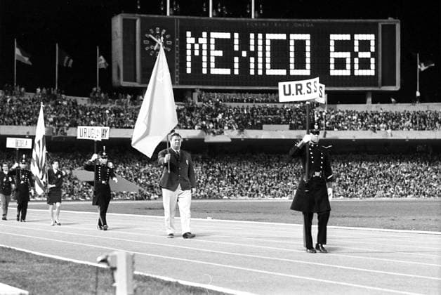 Mexico City, Mexico. October 27, 1968. Standard bearer of the USSR national team, Nationalteam weightlifer Leonid Zhabotinsky leads the team at the closing ceremony of the 1968 Summer Olympics. Sergei Preobrazhensky, Viktor Shandrin TASS  272238