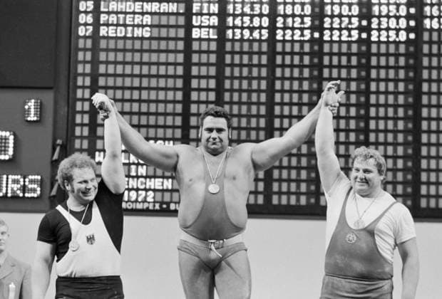 Munich, Federal Republic of Germany. September 7, 1972. Winners of the weightlifting competition, FRG athlete Rudolf Mang (2nd place), Soviet athlete Vasily Alekseev (1st place) and GDR athlete Gerd Bonk (3rd place) (L-R) stand on the podium during the award ceremony of the 1972 Summer Olympics. Alexander Katkov, Yuri Morgulis TASS  32395218