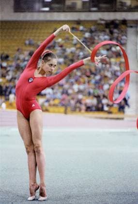 July 30 - August 2, 1979. Moscow, USSR. The silver medalist of the Spartakiad in the gymnastic all-around, Soviet gymnast Elena Tomasova performs with a ribbon at the final competitions of the 7th Summer Spartakiad of the Peoples of the USSR at the Sports Palace of the Central Lenin Stadium. The exact date of the photograph is unknown. Vyacheslav Un Da-Sin TASS  519561
