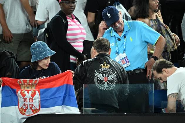 TENNIS AUSTRALIAN OPEN, A man wearing a jacket is removed as Novak Djokovic of Serbia takes on Andrey Rublev of Russia during their Quarterfinal match at the 2023 Australian Open tennis tournament at Melbourne Park in Melbourne, Wednesday, January 25, 2023. ( NO ARCHIVING, EDITORIAL USE ONLY, NO USE IN BOOKS WITHOUT CONSENT MELBOURNE VIC AUSTRALIA  Copyright: xJAMESxROSSx 20230126001756690504
