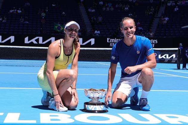 Luisa Stefani and Rafael Matos of Brazil lift the trophy after defeating Sania Mirza and Rohan Bopanna of India 7-6 6-2 in the Mixed Doubles Final match, Day 12 at the Australian Open Tennis 2023 at Rod Laver Arena, Melbourne, Australia on 27 January 2023. Copyright: xPeterxDovganx 34782437