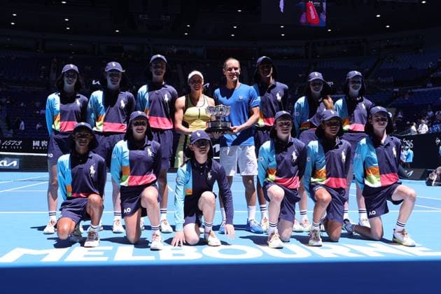 Luisa Stefani and Rafael Matos of Brazil lift the trophy with the ball boys after defeating Sania Mirza and Rohan Bopanna of India 7-6 6-2 in the Mixed Doubles Final match, Day 12 at the Australian Open Tennis 2023 at Rod Laver Arena, Melbourne, Australia on 27 January 2023. Copyright: xPeterxDovganx 34782438