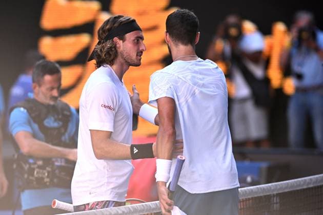 TENNIS AUSTRALIAN OPEN, Stefanos Tsitsipas of Greece (left) embraces Karen Khachanov of Russia after winning their Men?s semi final match at the 2023 Australian Open tennis championship at Melbourne Park in Melbourne, Friday, January 27, 2023. ( NO ARCHIVING, EDITORIAL USE ONLY, NO USE IN BOOKS WITHOUT CONSENT MELBOURNE VICTORIA AUSTRALIA  Copyright: xJOELxCARRETTx 20230127001757080024