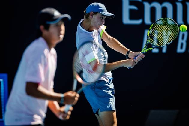 Learner Tien ATP, Tennis Herren 1111) and Cooper Williams (ATP 860) pictured during a tennis match between Belgian-Brazilian pair Blockx-Fonseca and American pair Tien-Williams, in the final of the junior boys doubles at the Australian Open tennis Grand Slam, Friday 27 January 2023 in Melbourne Park, Melbourne, Australia. PATRICKxHAMILTON  x58802167x